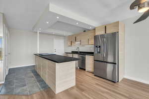 Contemporary kitchen cabinets and pull-out drawers enhance the quality of working in this new kitchen.