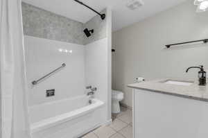 Spacious, light, and bright full bath with granite countertop and new toilet