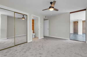 Primary bedroom has a new ceiling fan, it's own half bath and the closet has closet organizers.