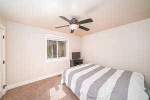 Bedroom featuring carpet floors and ceiling fan