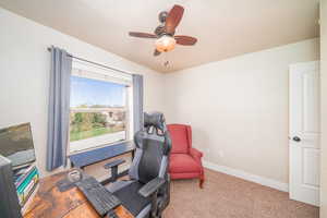 Office area featuring ceiling fan and carpet floors