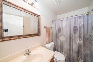 Bathroom with vanity and toilet