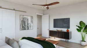 Bedroom with ceiling fan and light hardwood / wood-style flooring