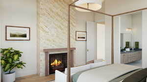 Bedroom with a fireplace, light wood-type flooring, a towering ceiling, sink, and ensuite bathroom