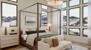 Bedroom featuring a mountain view and hardwood / wood-style flooring