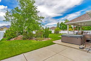 Exterior space with a hot tub