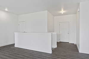 Spare room featuring dark hardwood / wood-style flooring