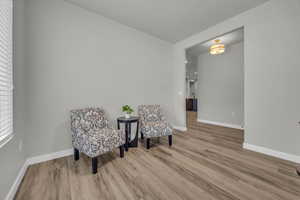 Living area featuring hardwood / wood-style flooring