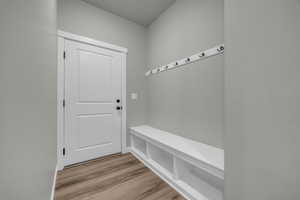 Mudroom with light hardwood / wood-style flooring