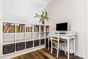 Vaulted Loft overlooking the Great Room with Built In Bookshelf