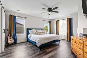 Master Bedroom Upstairs with ceiling fan and Balcony