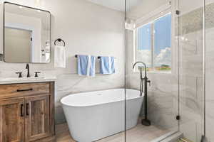 Master Bathroom with Double Vanity, Free Standing Tub and Custom Tile and Shower Gla$$