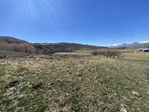 Property view of mountains with a rural view