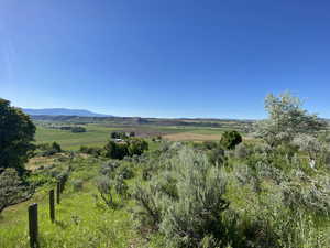 Property view of mountains with a rural view