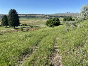 View of mountain feature with a rural view