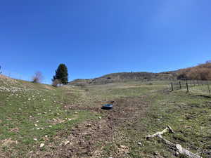 Property view of mountains featuring a rural view