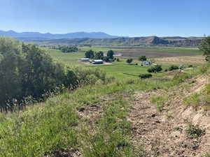 Property view of mountains with a rural view