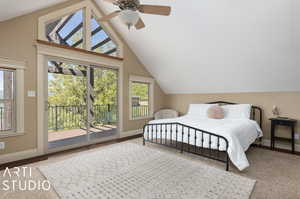 Bedroom with access to outside, carpet flooring, ceiling fan, and vaulted ceiling