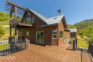 Deck featuring a mountain view and central AC unit