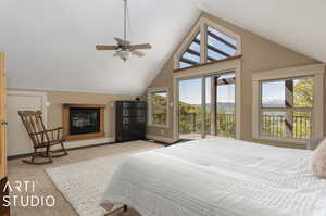 Carpeted bedroom with access to outside, high vaulted ceiling, and ceiling fan