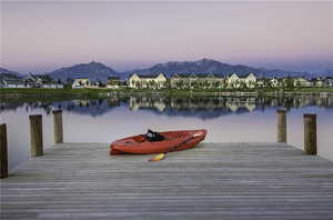 Dock area with a water and mountain view