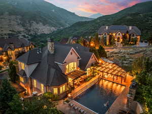 Aerial view at dusk featuring a mountain view