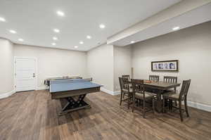 Game room featuring dark hardwood / wood-style floors