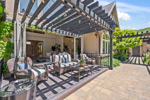 View of patio with a pergola and an outdoor living space