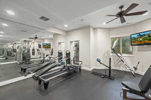 Workout area featuring ceiling fan