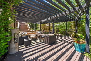 View of patio / terrace featuring a pergola, an outdoor living space, and a wooden deck