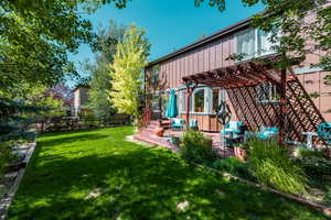 Exterior space with a patio area and a pergola