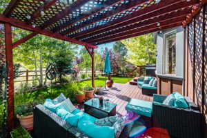 View of patio / terrace with a pergola, an outdoor living space, and a wooden deck