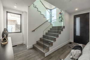 Foyer entrance with wood-type flooring