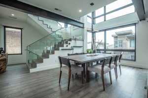 Dining space featuring a wealth of natural light and hardwood / wood-style flooring