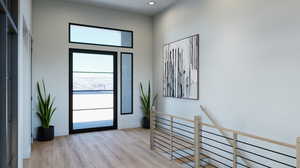 Entryway with light hardwood / wood-style flooring