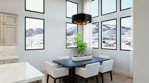 Dining room with light hardwood / wood-style floors, plenty of natural light, and a mountain view