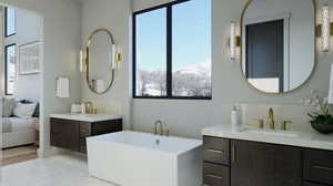 Bathroom featuring a washtub, a mountain view, hardwood / wood-style floors, and double sink vanity