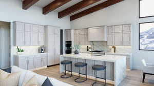 Kitchen featuring a kitchen island with sink, light hardwood / wood-style flooring, and tasteful backsplash