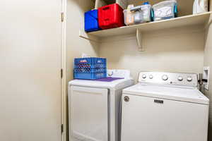 Washroom featuring washer and clothes dryer and washer hookup