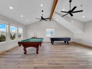 Recreation room featuring ceiling fan, lofted ceiling with beams, light wood-type flooring, and pool table