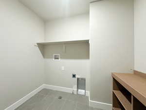 Laundry room with baseboards, laundry area, washer hookup, and hookup for an electric dryer