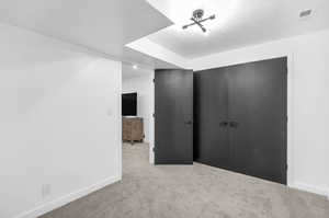 Unfurnished bedroom featuring carpet flooring and a closet