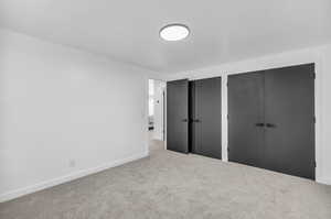 Unfurnished bedroom with two closets and carpet floors