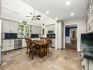 Kitchen with ceiling fan, lofted ceiling, lots of counter space