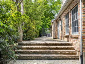 Stone terrace / patio directly outside a large living room.