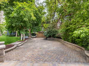 View of backyard patio / terrace (storage shed)