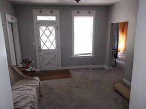 View of carpeted entrance foyer