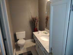 Bathroom with oversized vanity and toilet