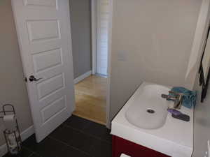 Bathroom featuring vanity and tile floors