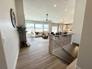 Corridor featuring hardwood / wood-style flooring and a textured ceiling